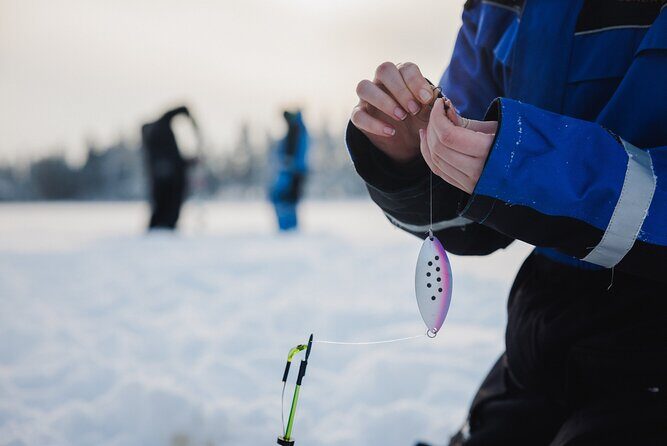 Ice Fishing and Snowmobile Safari Combo in Lapland - Ice fishing on the frozen lake: short rods, big patience